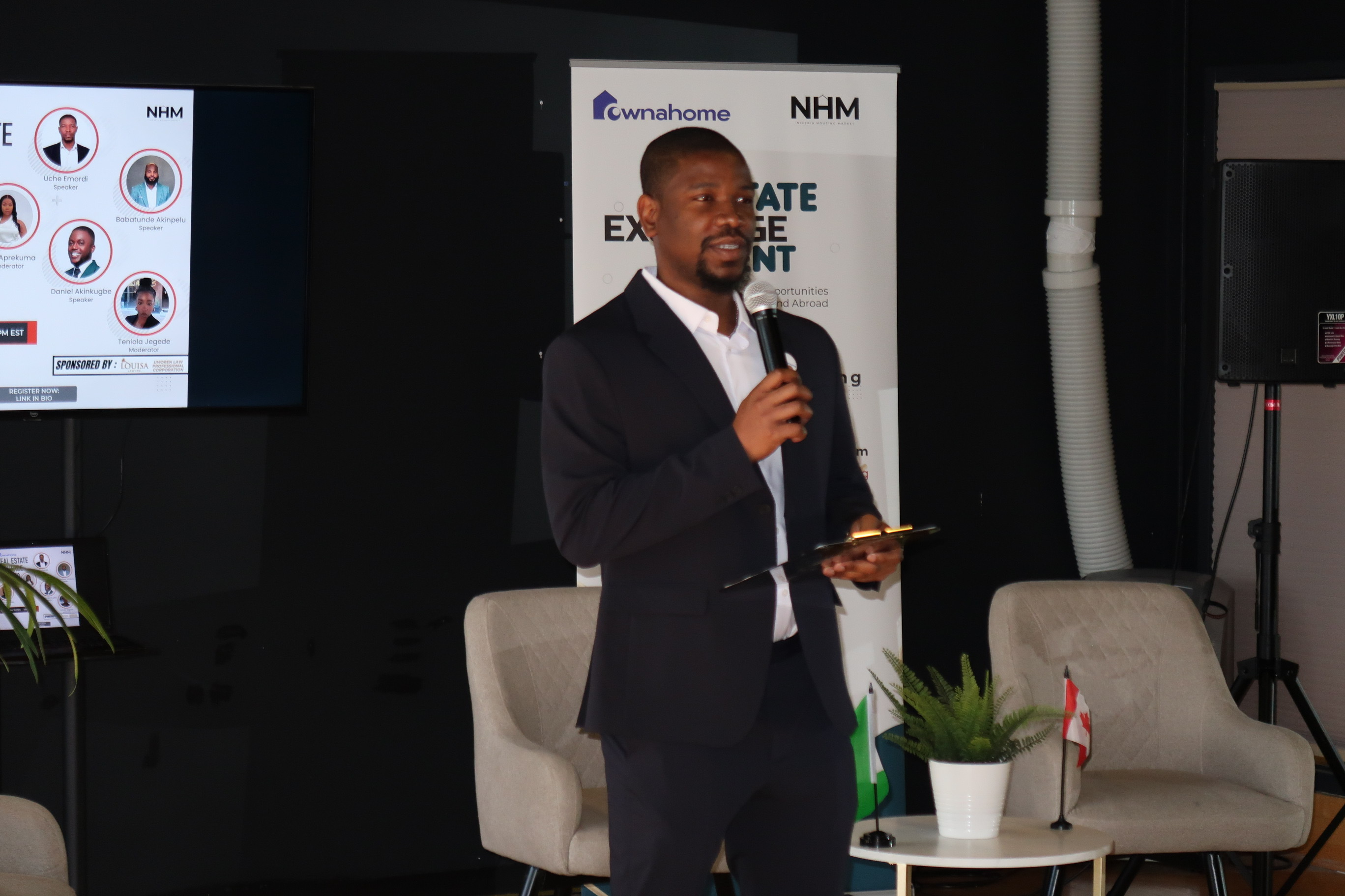 Uche Emordi presenting at a real estate event